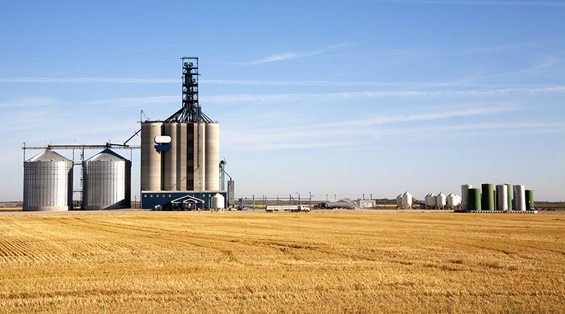 Prairie elevator and grain bin in the morning, Saskatchewan, Canada.