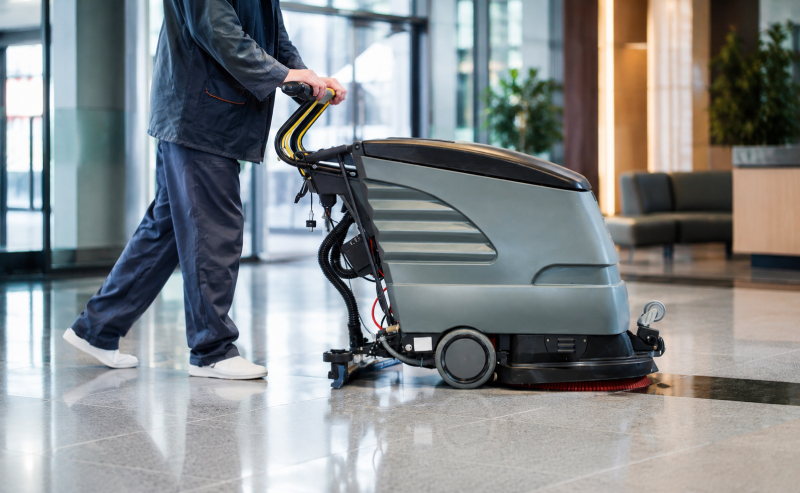 floor cleaner machine being used in a building lobby
